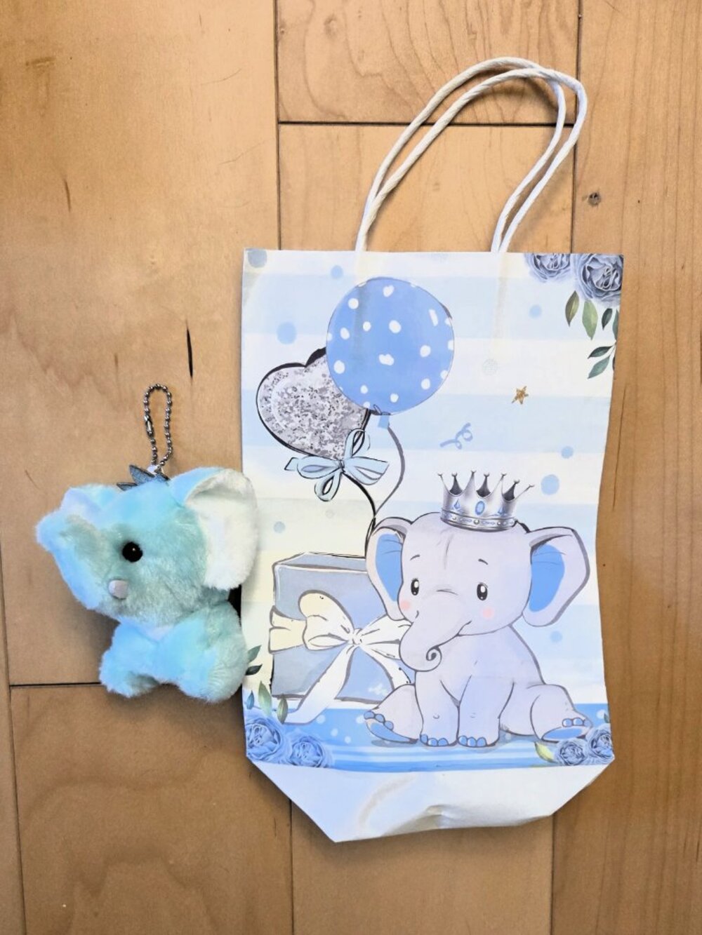 Crowned Baby Elephant Blue Keychain plush keychain paired with a matching bag